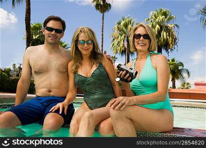 Two Women and a Man at the Pool
