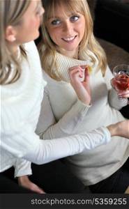 Two women drinking wine together