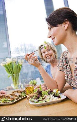 Two women eating health food