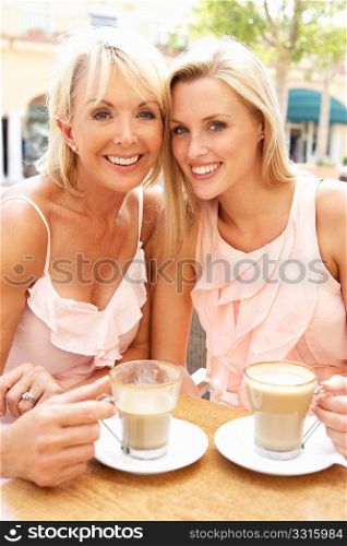 Two Women Enjoying Cup Of Coffee In CafZ