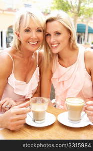 Two Women Enjoying Cup Of Coffee In CafZ