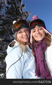 Two women enjoying their skiing holiday