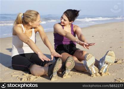 Two Women Exercising On Beach