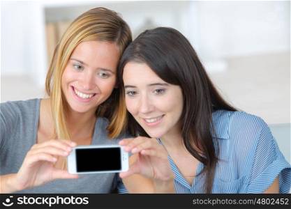 two women friends take selfie