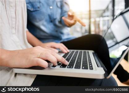 two women friendship working at library and use laptop