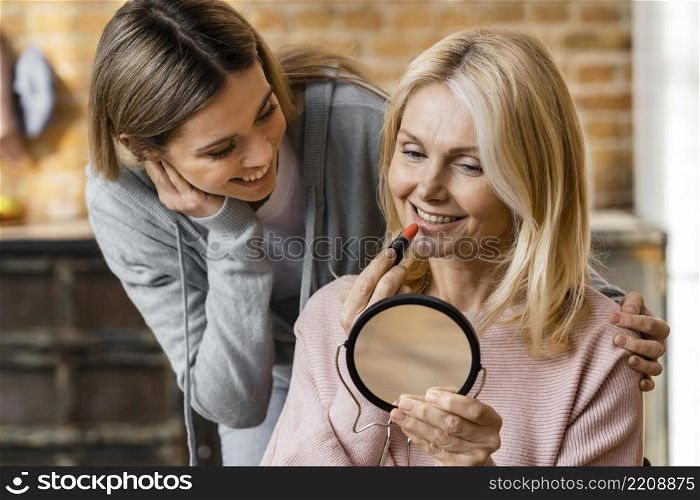 two women getting their make up home