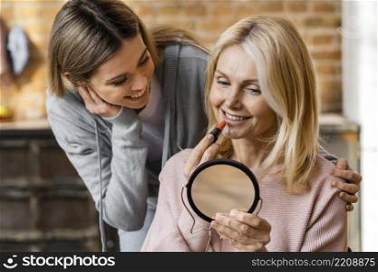 two women getting their make up home