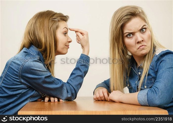 Two women having argue mocking up being mad at each other. Female telling off, ignorance concept.. Two women having argue fight