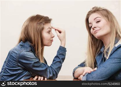 Two women having argue mocking up being mad at each other. Female telling off, ignorance coversation concept.. Two women having argue