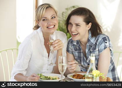 Two Women Having Meal In Cafe