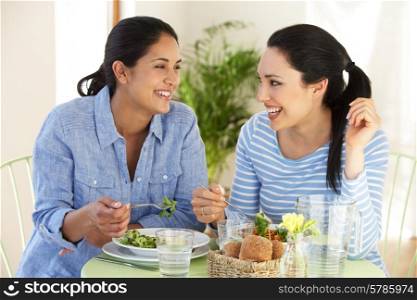 Two Women Having Meal In Cafe