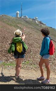 two women hikers on the trail of Pic du Midi de Bigorre in the Pyrenees France