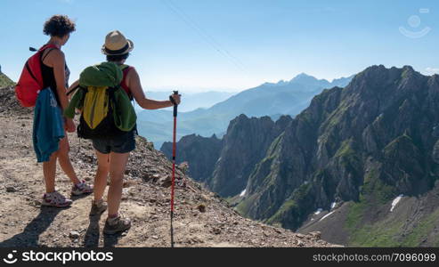 two women hikers on the trail of the Pic du Midi de Bigorre in the Pyrenees