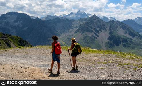 two women hikers on the trail of the Pic du Midi de Bigorre in the Pyrenees
