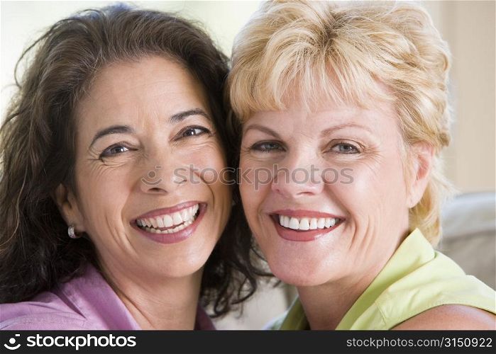Two women in living room smiling