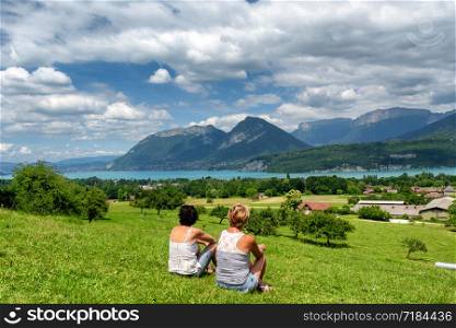 two women looking at the Annecy lake in France