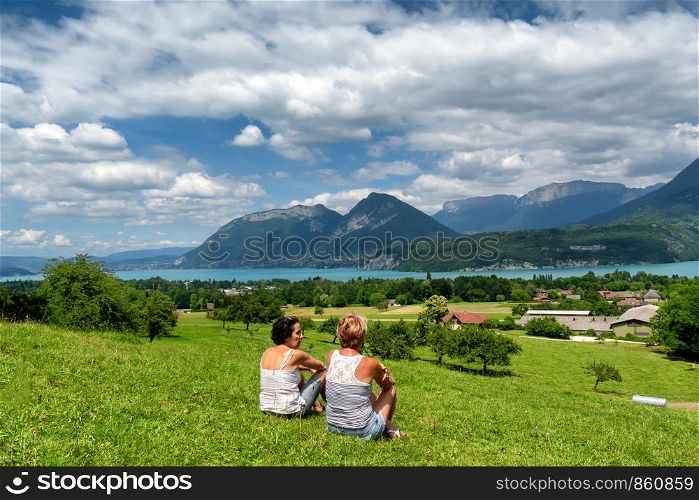 two women looking at the Annecy lake in France