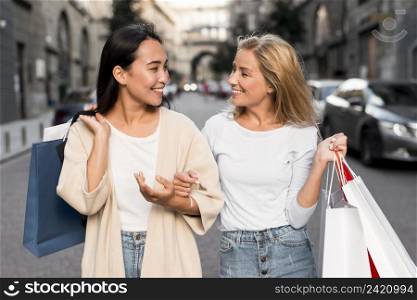 two women out city going shopping spree
