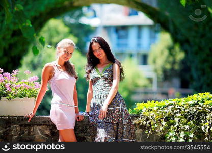 Two women over park background
