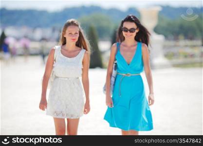 Two women over street background