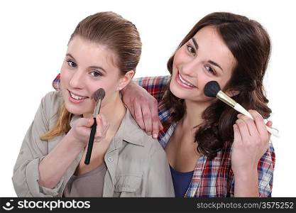 Two women pampering themselves