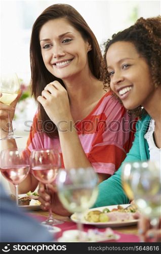 Two Women Relaxing At Dinner Party