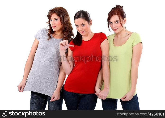 two women showing their t-shirts, one woman pointing finger toward herself