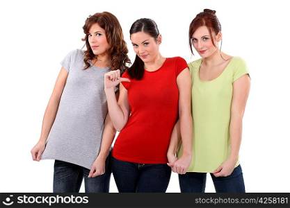 two women showing their t-shirts, one woman pointing finger toward herself