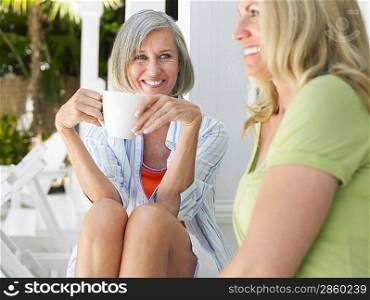 Two women sitting on verandah