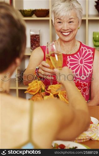 Two women toasting with champagne flutes