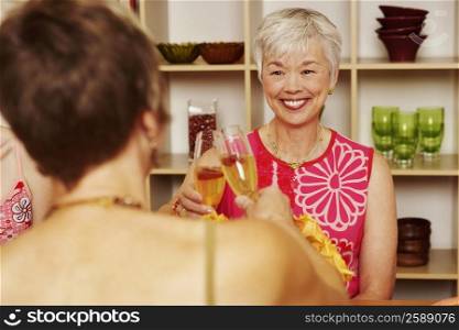 Two women toasting with champagne flutes