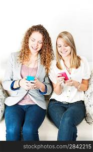 Two women using mobile devices
