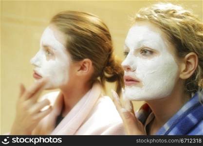 Two women with face masks