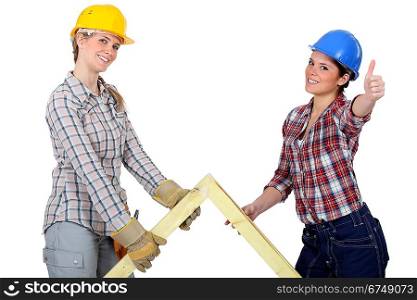 Two women with wooden truss