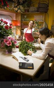Two women working in flowers shop
