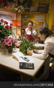 Two women working in flowers shop
