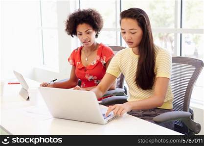 Two Women Working Together In Design Studio
