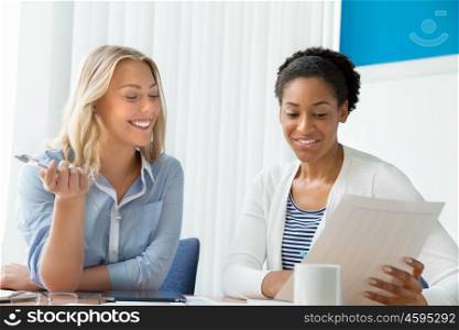 Two women working together in office