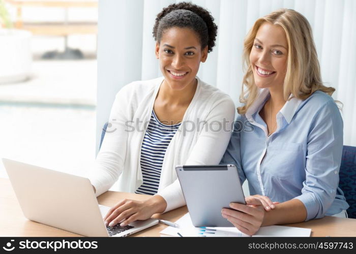 Two women working together in office