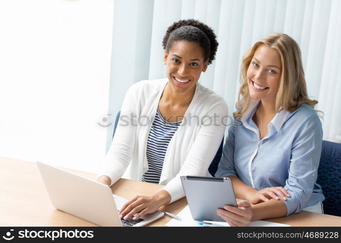 Two women working together in office