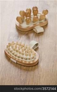 two wooden massagers