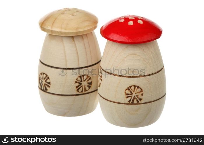 Two wooden saltcellars-pepperboxes are isolated on a white background