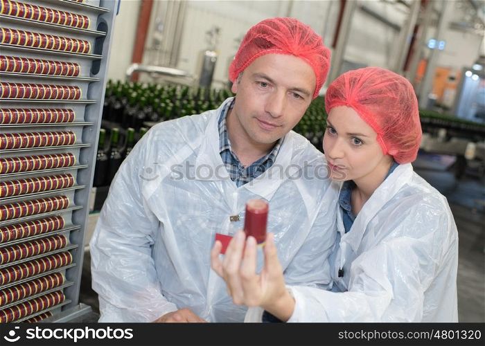 two workers doing a quality health control