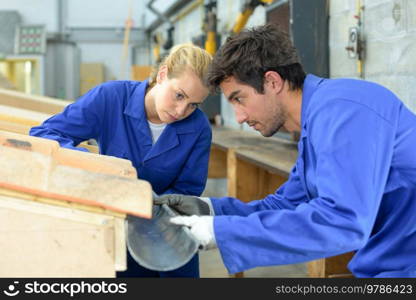 two workers installing a gutter