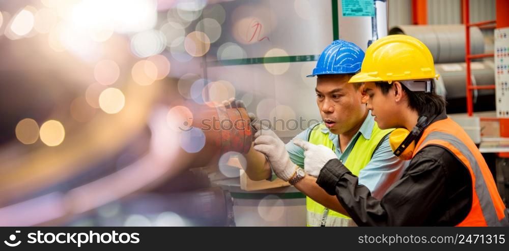 Two workers man talking working in factory, male supervisor talking with engineers for maintenance and inspection machinery at industry manufacturing
