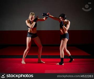 Two wrestler woman at gym