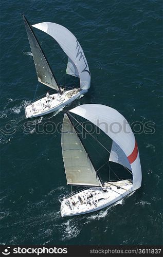 Two yachts compete in team sailing event California