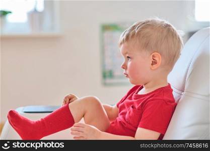 Two year old boy watching tv
