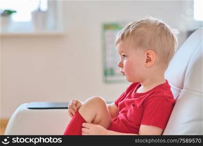 Two year old boy watching tv