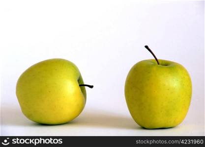 Two yellow apples isolated on white background